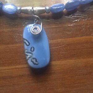 Blue semi precious stones necklace.  Beautiful detail in agate pendant.